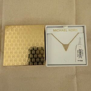 MICHAEL KORES Gold tone color pendent .